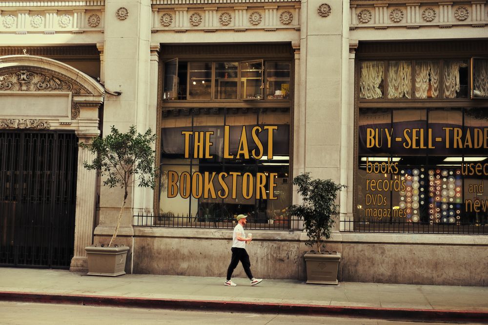 Pedestrian passing a Downtown Los Angeles storefront