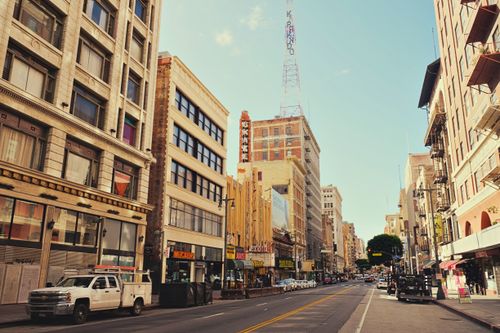 Free Urban scene of a bustling Los Angeles street showcasing historic architecture and city life. Stock Photo