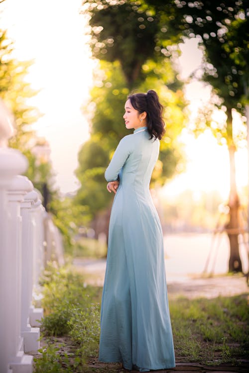 A Woman in Blue Long Sleeve Dress