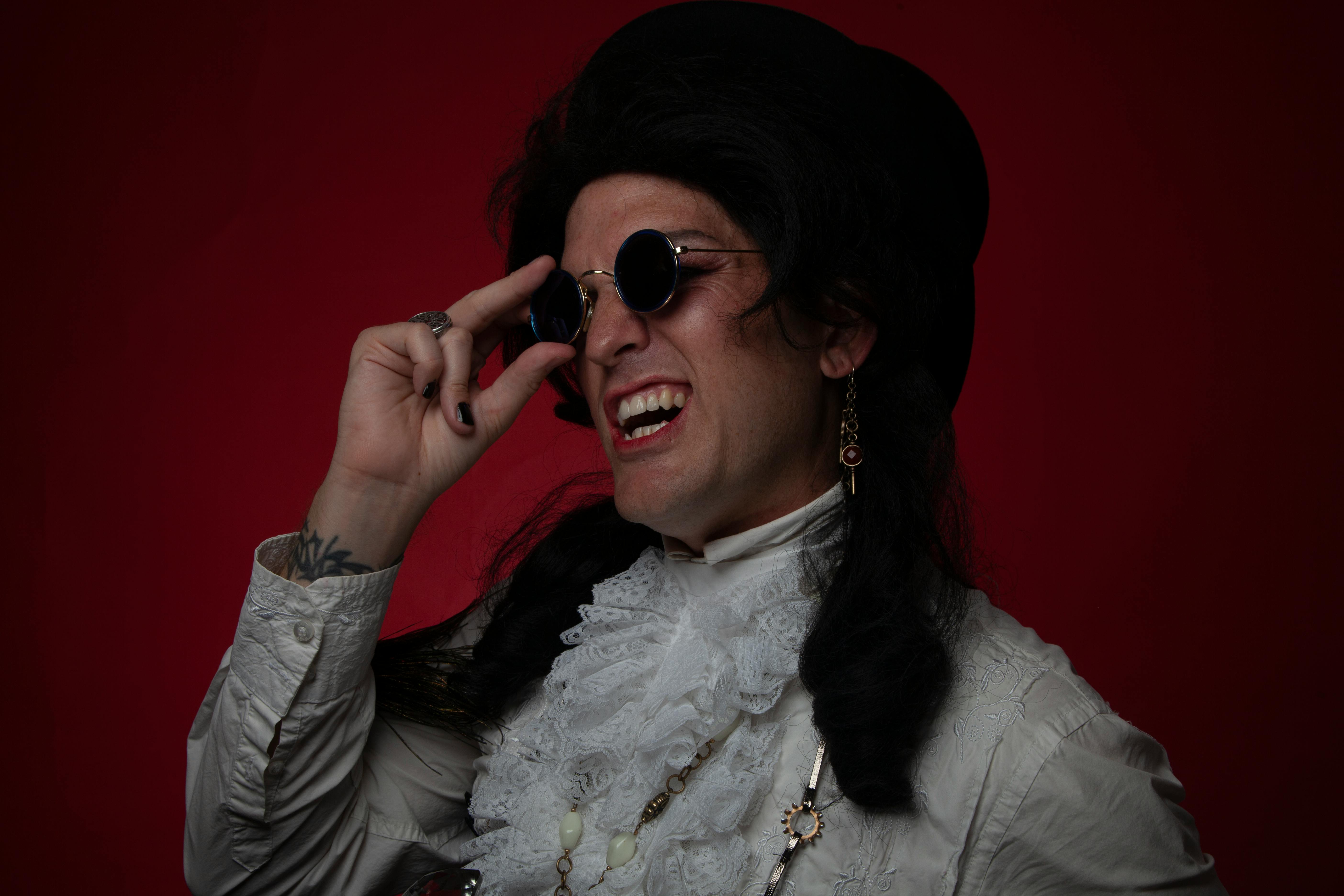 Smiling Man Wearing a Wig and Retro White Shirt · Free Stock Photo