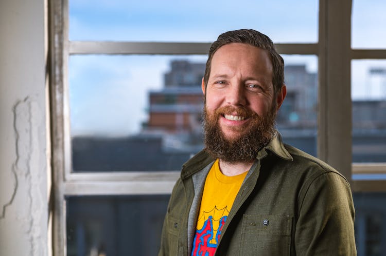 Bearded Man In Button Down Shirt Smiling