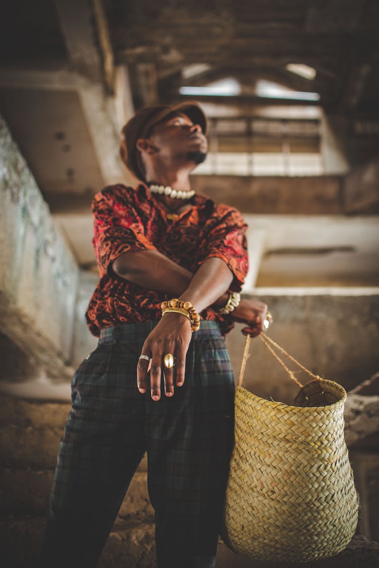 Man Holding Straw Basket