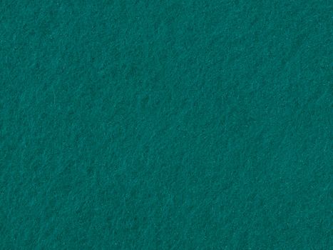 Detailed close-up view of teal felt texture, ideal for backgrounds and designs.