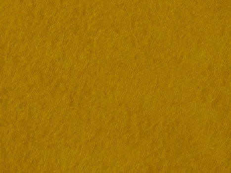 Close-up view of a warm yellow textured surface, ideal for backgrounds.