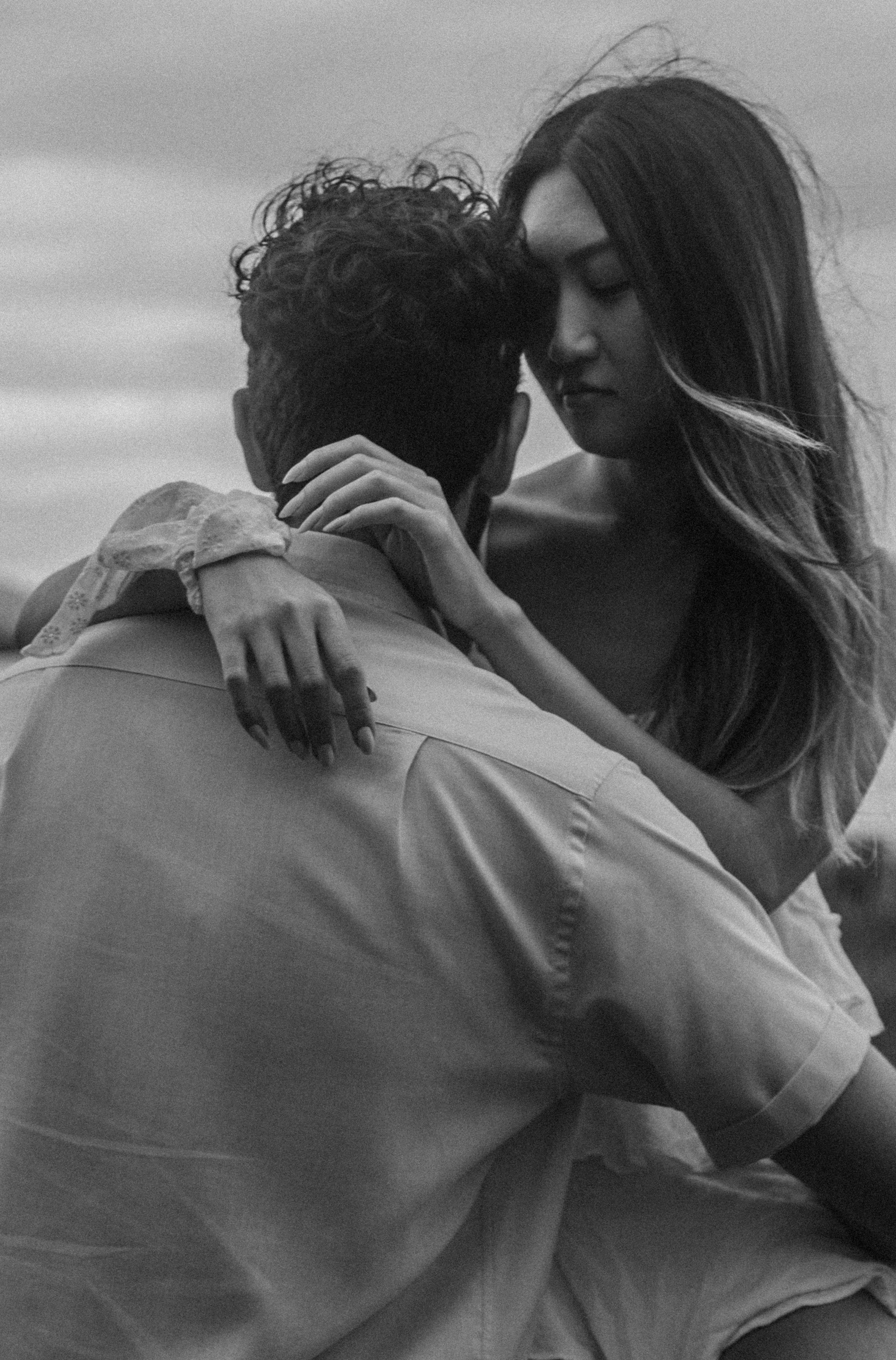 Black and White Photo of a Couple Sitting Outside and Hugging · Free ...