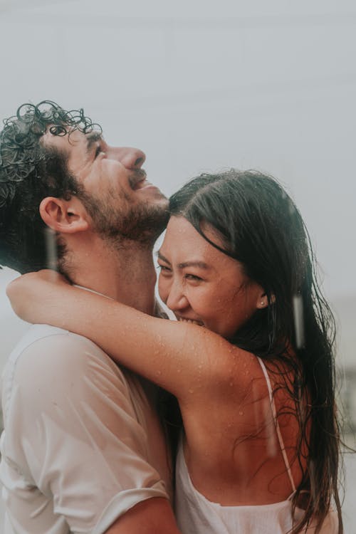 Woman and Man Hugging in the Rain