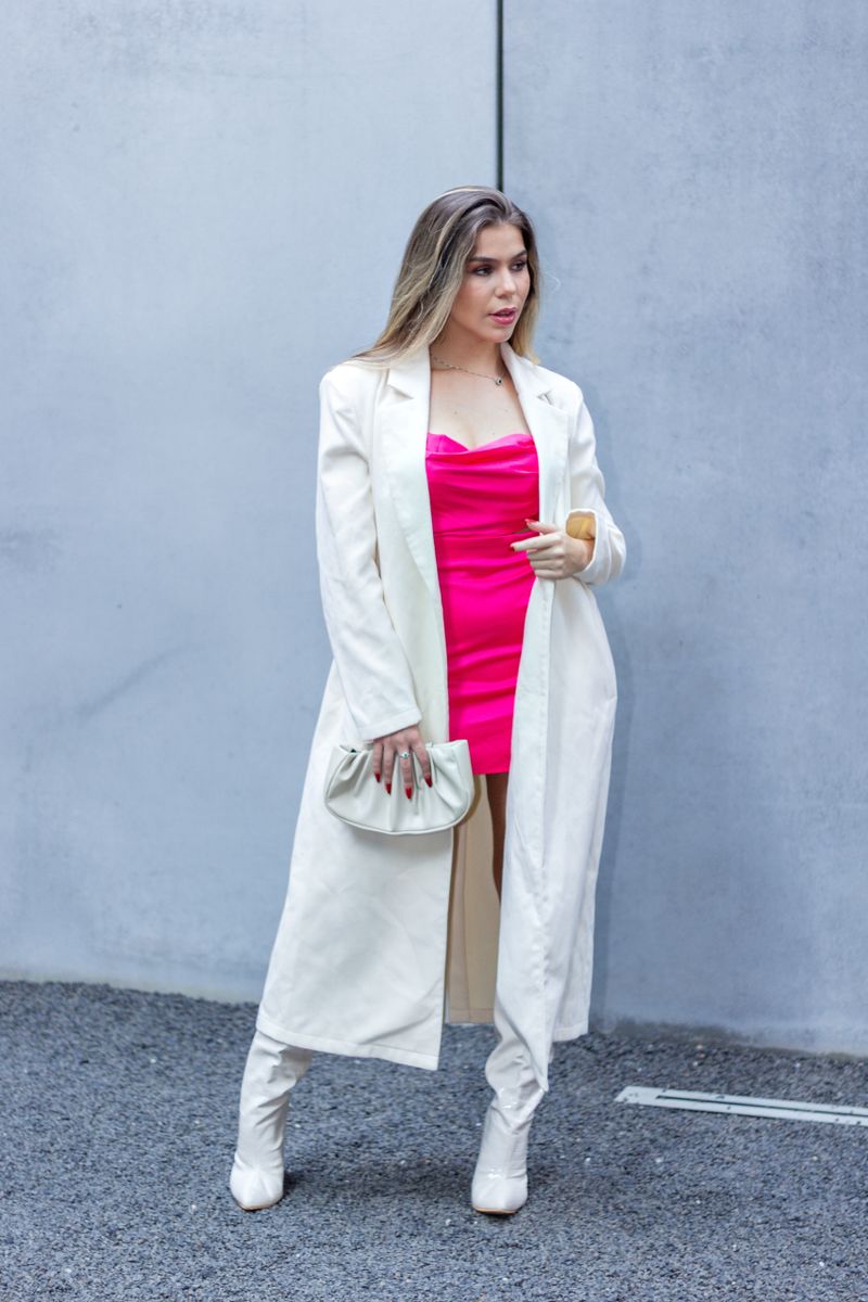 Woman in pink dress and white coat, chic date night outfit