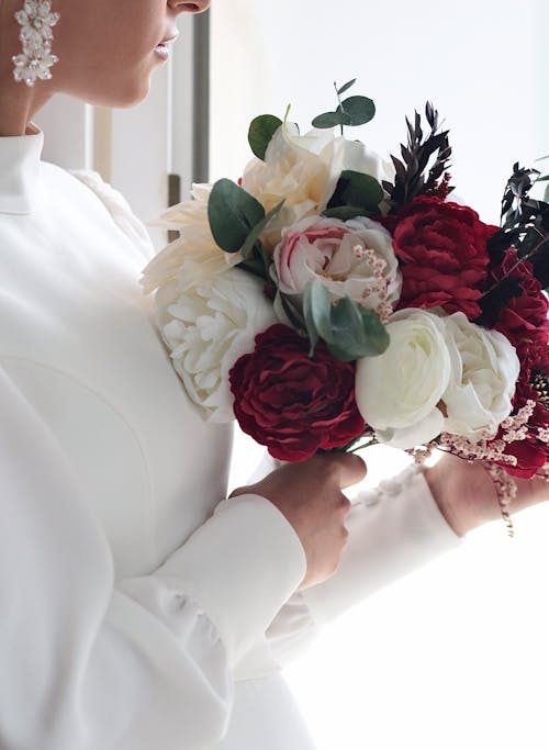 Close up of Bride Holding Flowers Bouquet