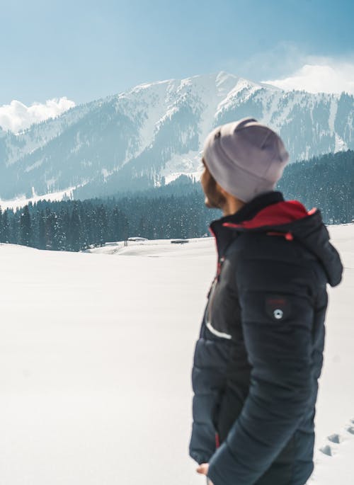Mountains in Winter behind Man in Jacket