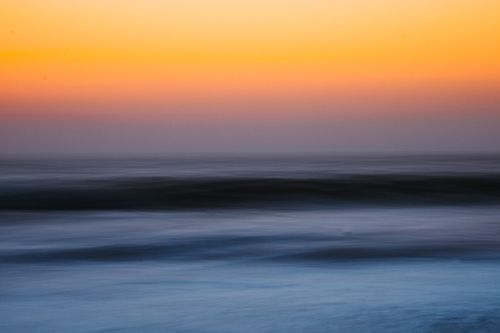 Free Vibrant sunset over the serene Maravanthe ocean in Karnataka, India. Stock Photo
