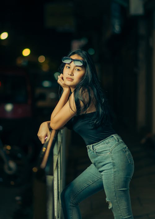 Photo of an Attractive Young Girl in the Street at Night