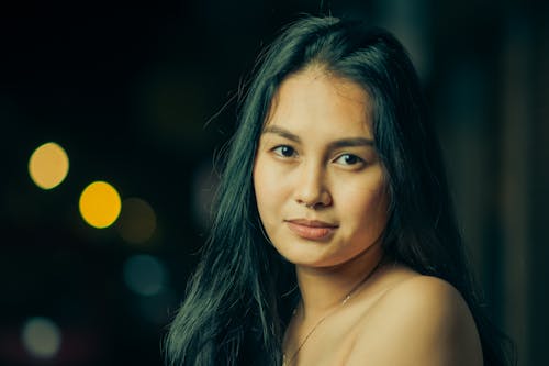 Portrait of an Attractive Young Woman at Night