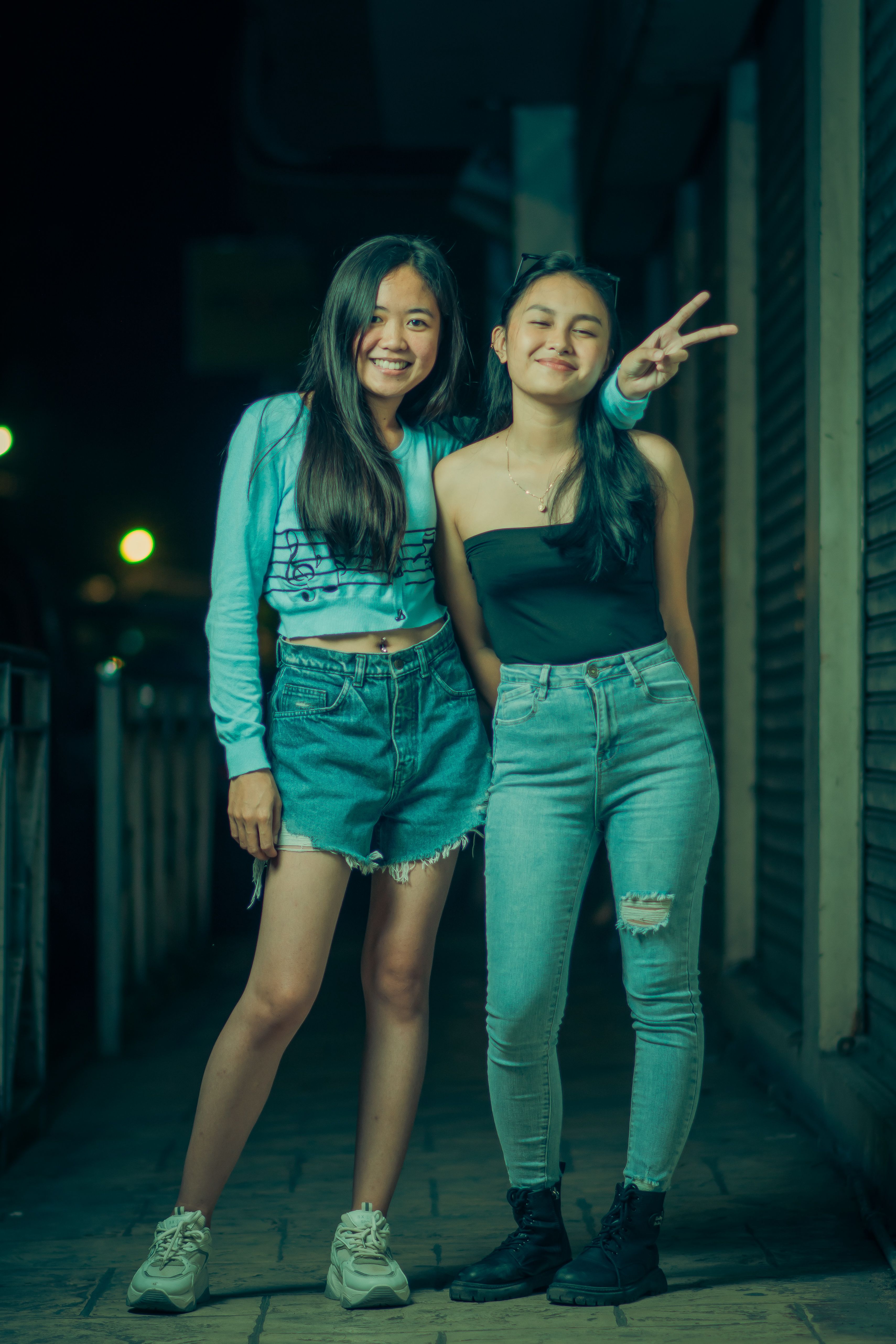 Photo of Two Pretty Young Women Standing in the Street at Night · Free ...