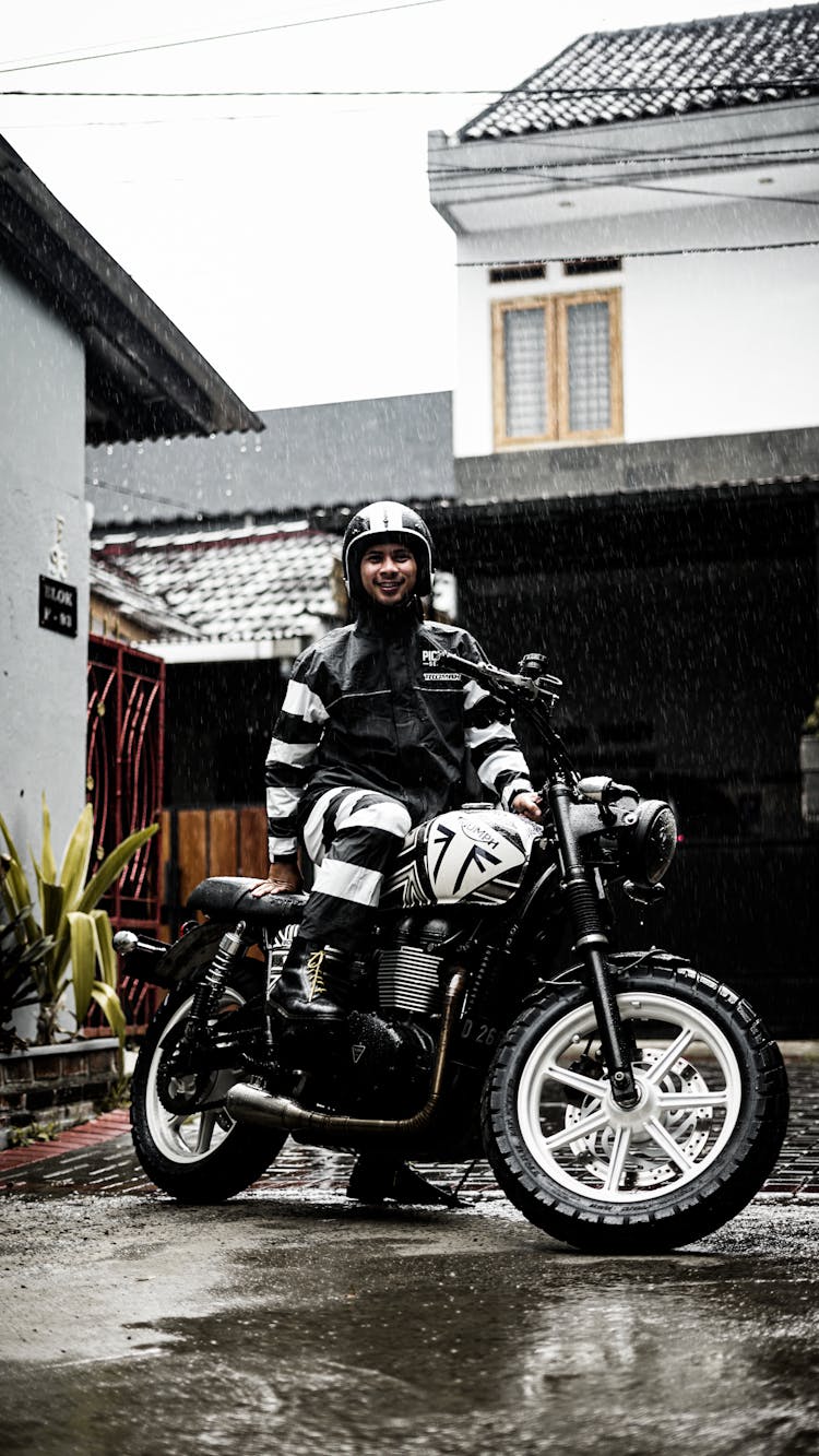 Photo Of A Smiling Man Sitting On His Motorcycle