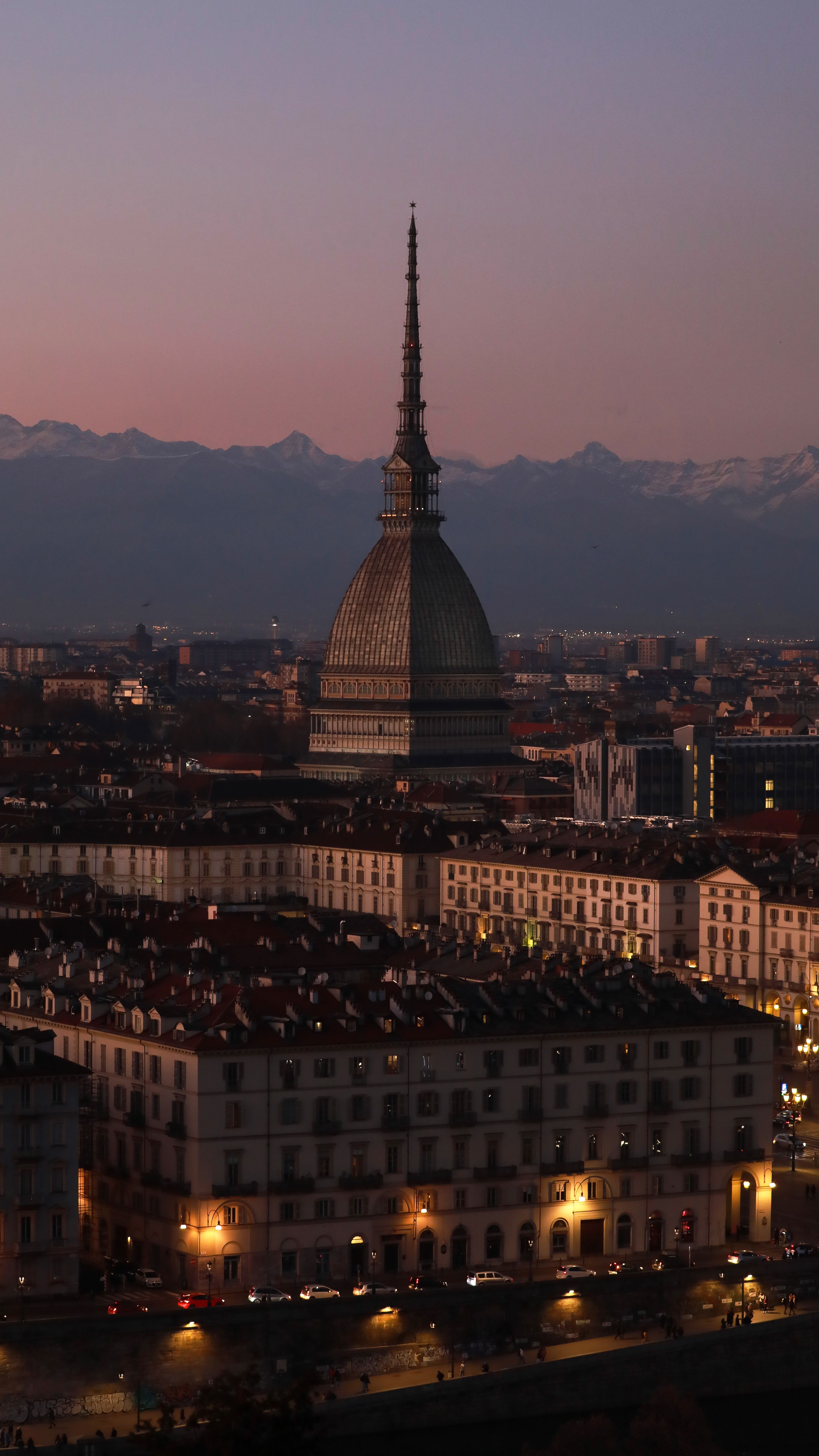 A stunning view of Mole Antonelliana in Turin, Italy during a serene evening twilight.