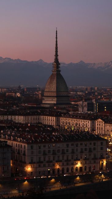A stunning view of Mole Antonelliana in Turin, Italy during a serene evening twilight.