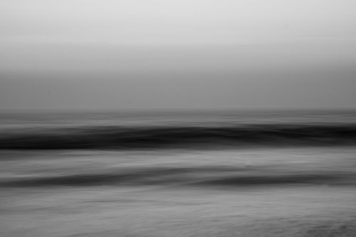 Free Black and white minimalist capture of ocean waves at Maravanthe Beach, India. Stock Photo