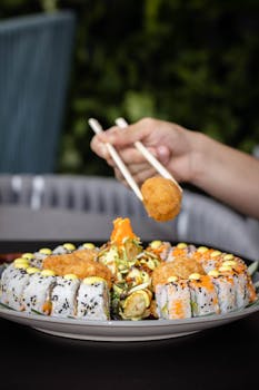A colorful sushi platter with different types of sushi rolls, appetizingly served.