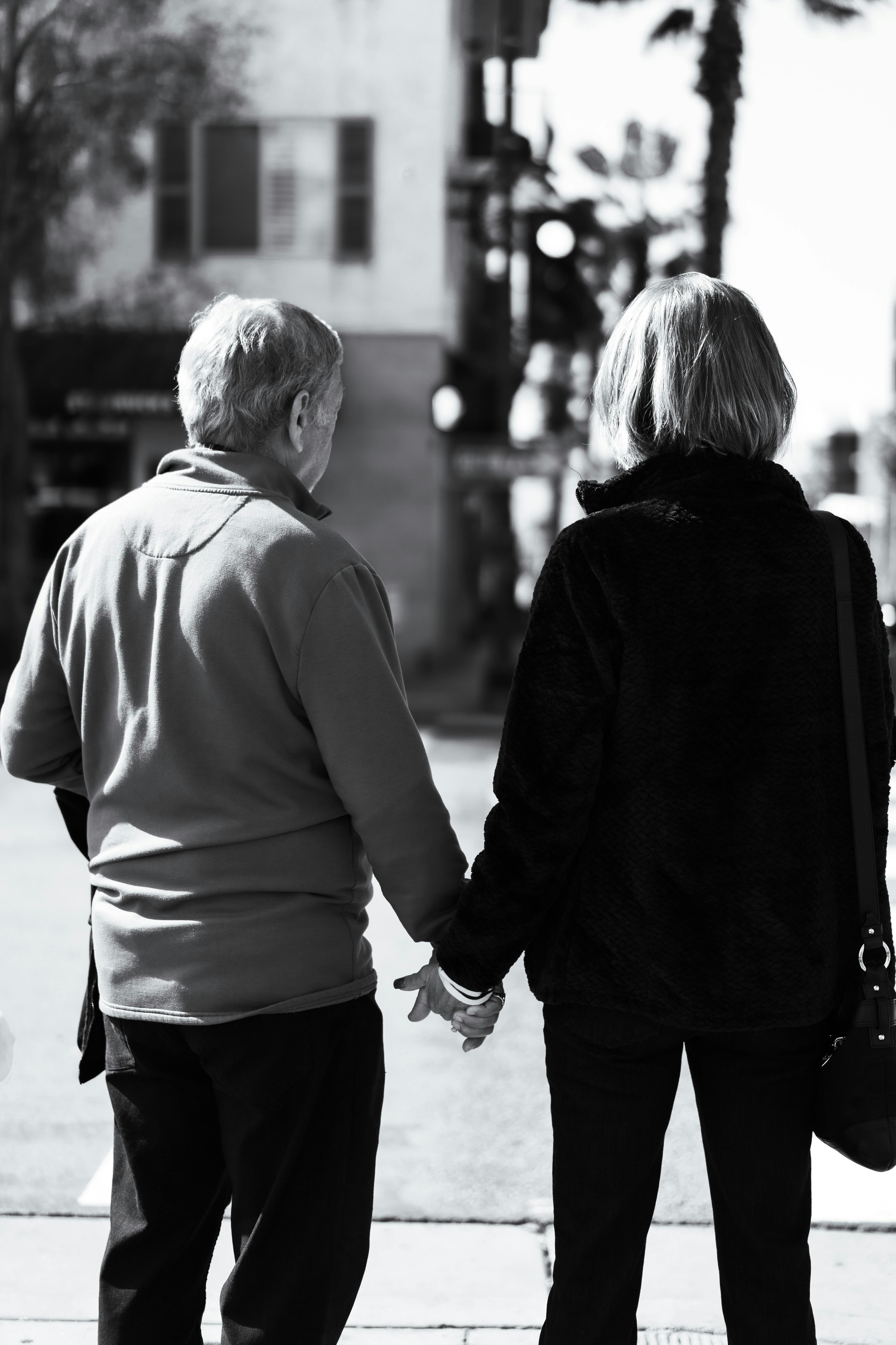 Woman Helping Elderly Woman to Walk on Sidewalk · Free Stock Photo