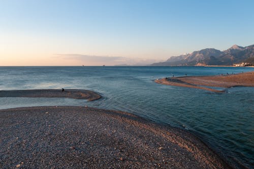 Mountains on the Shore and the Seascape in the Evening 