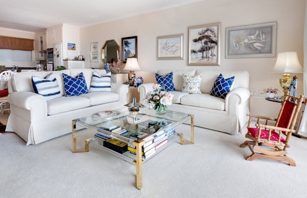 white living room with skirted sofas - granny chic interiors - coastal grandma style - Fall 2023 decor trends