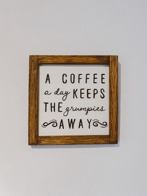 Wooden framed wall art with coffee quote in stylish typography, perfect for home decor.