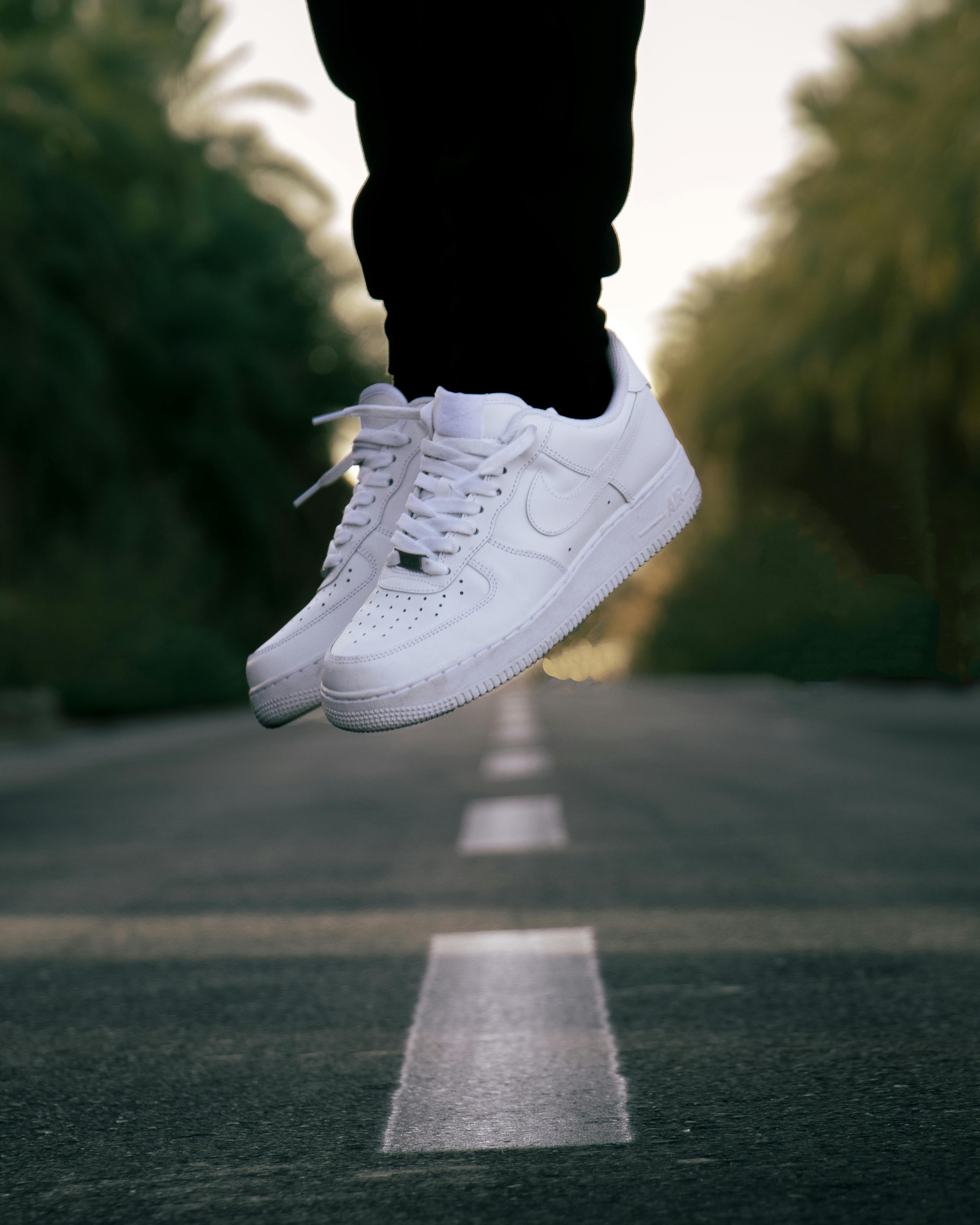 person wearing white sneakers