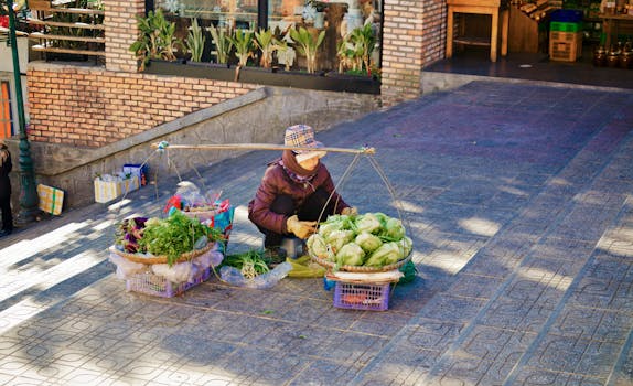 A street vendor selling fresh vegetables in baskets on a sunny day, showcasing urban marketplace life.