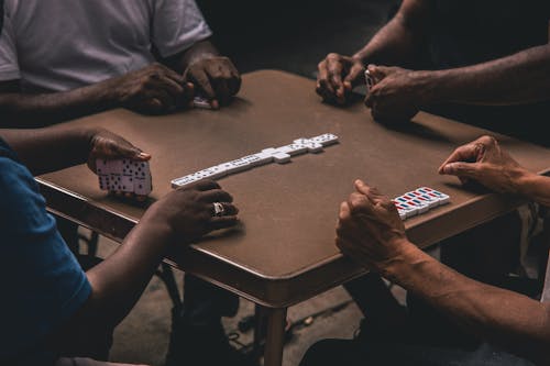 Free Four People Playing Dominoes Stock Photo
