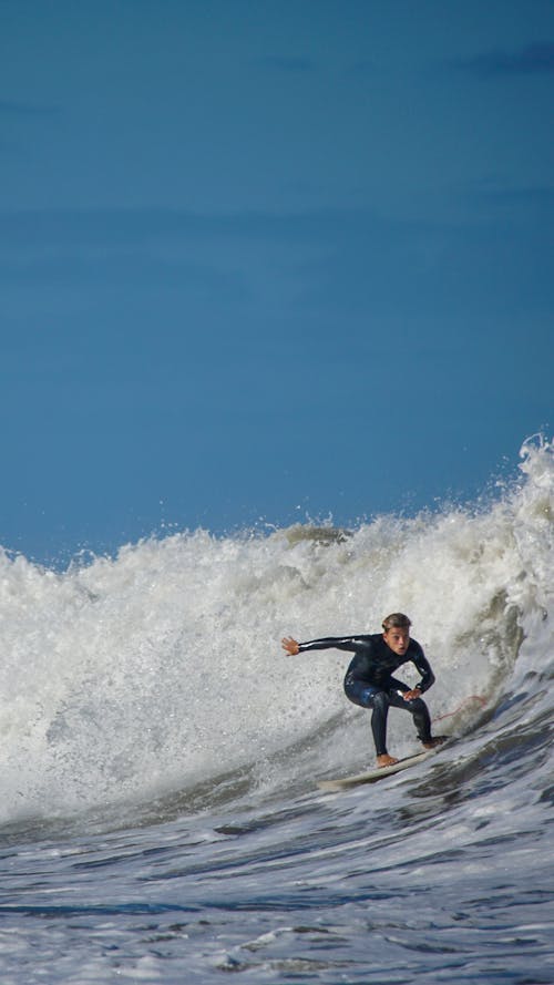 Photo of a Man Surfing