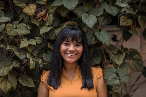 Portrait Photo of Woman in Yellow Top Smiling