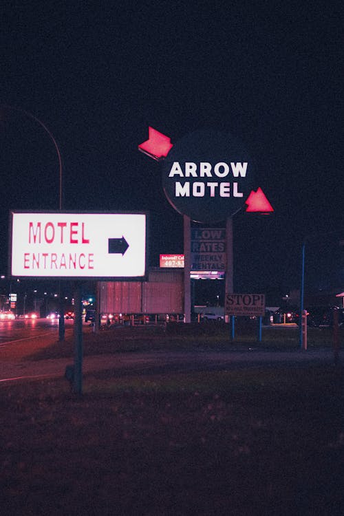 Directional Signs to Motel at Night