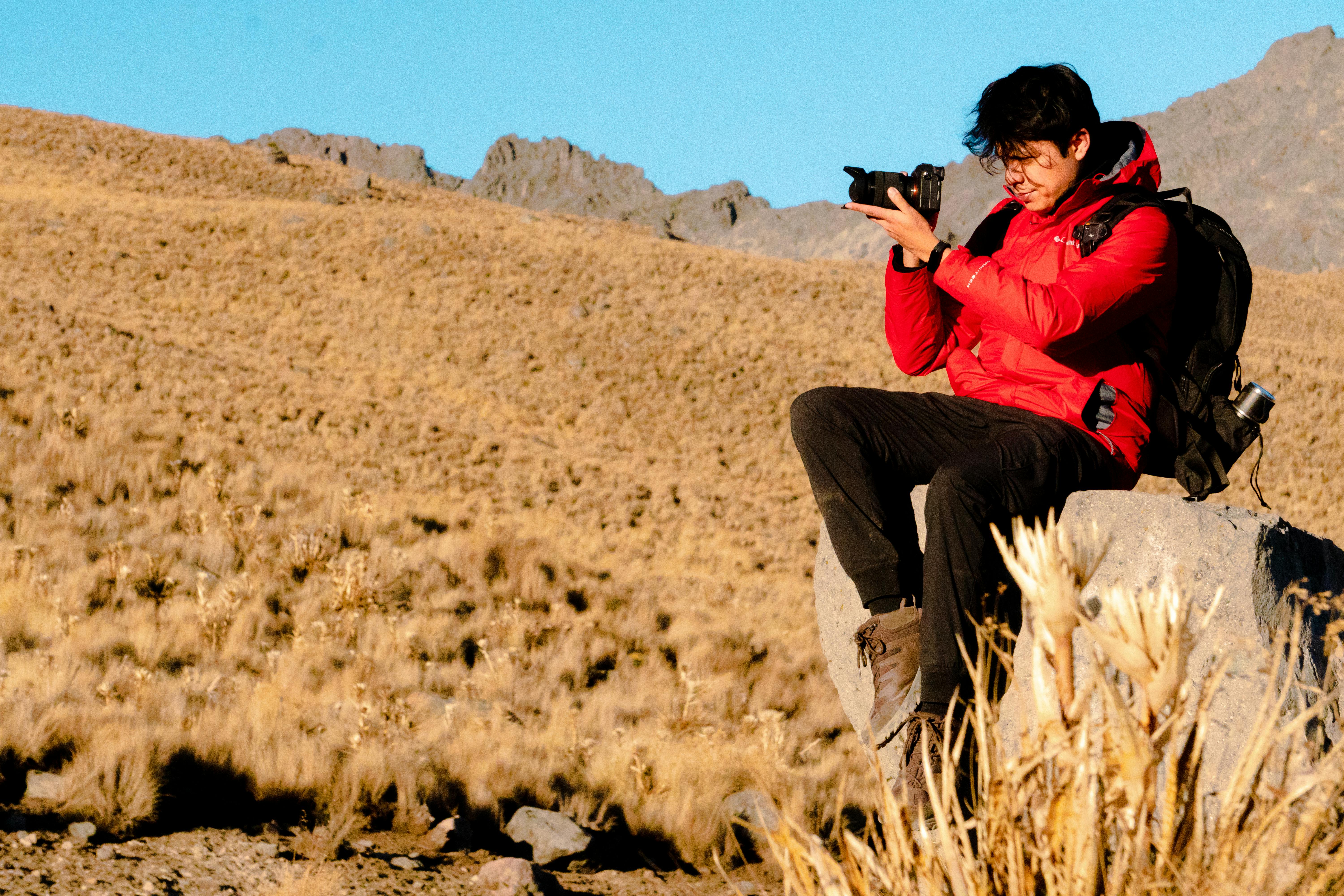 Backpacker Documenting Experience