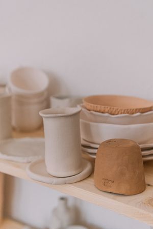 Unfired pots on a studio shelf — Oleg Prachuk on Pexels