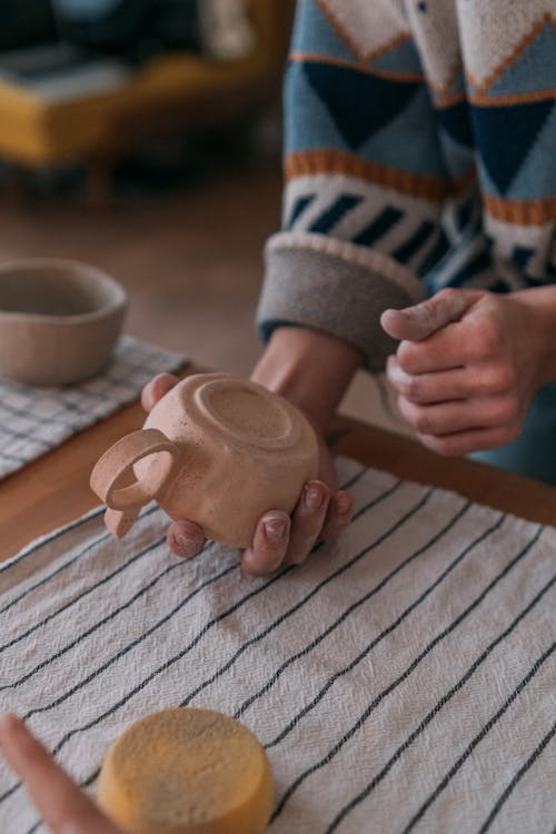 A Person Holding a Cup