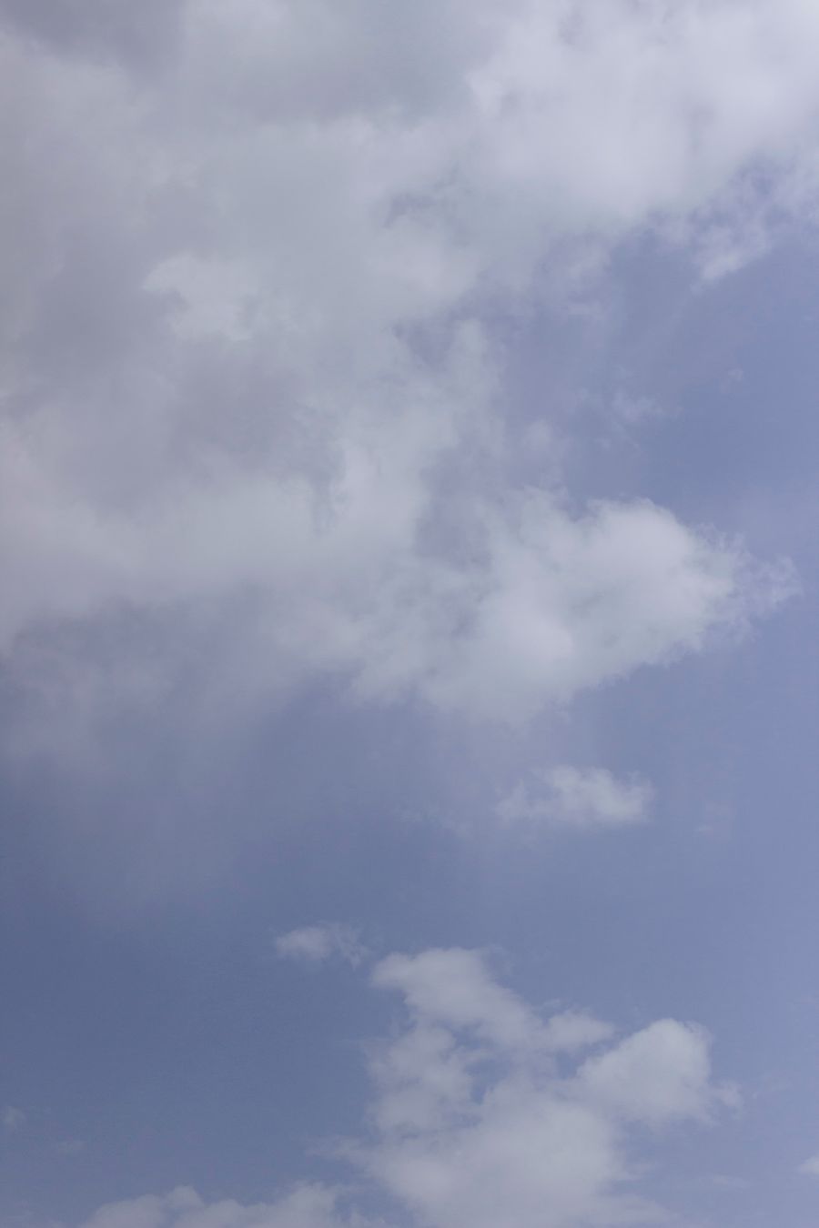 Soft blue sky with pale drifting clouds — photo by Alina Skazka on Pexels