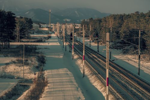 Free A scenic winter view of a railway cutting through snowy forest in Styria, Austria. Stock Photo