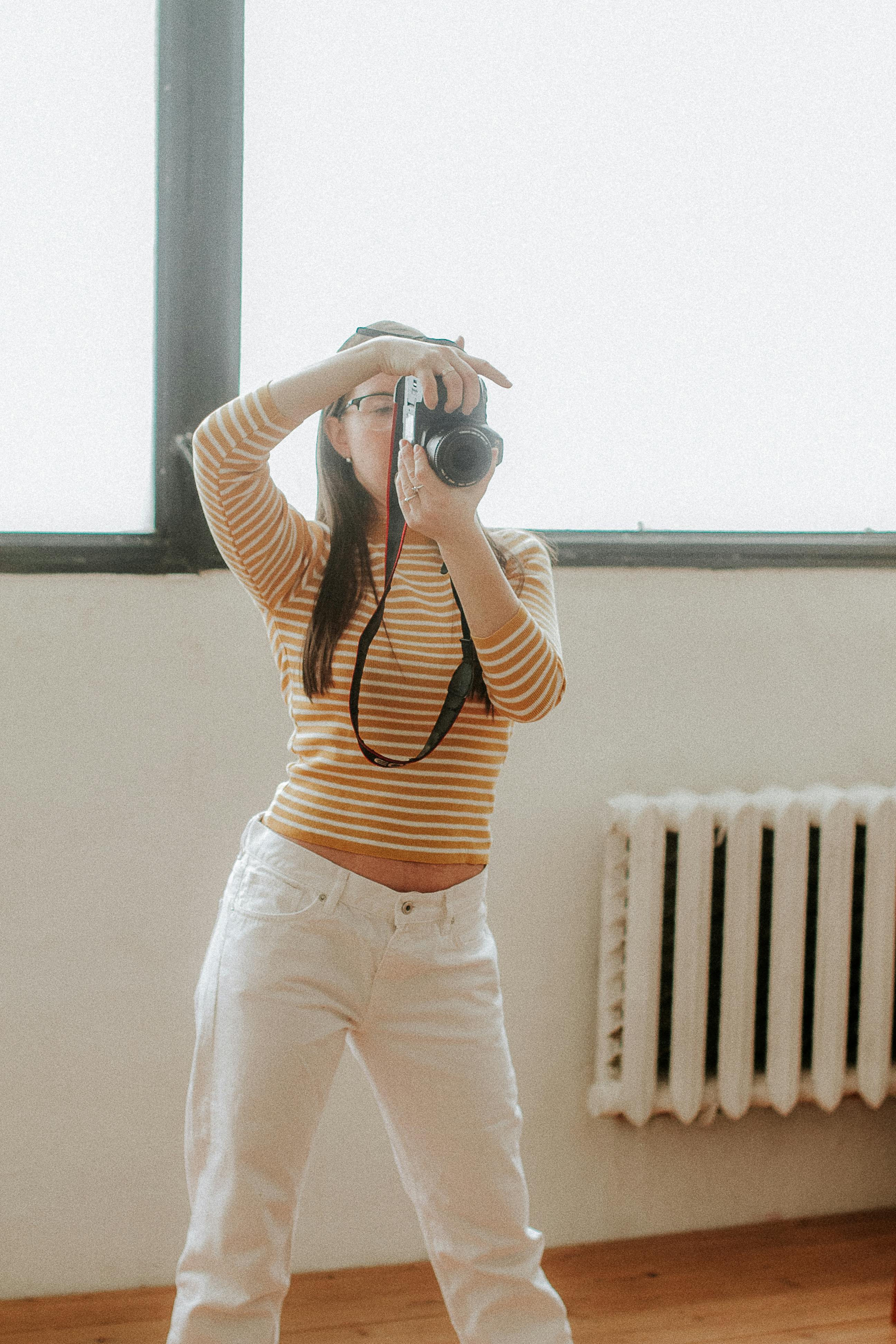 woman standing with camera