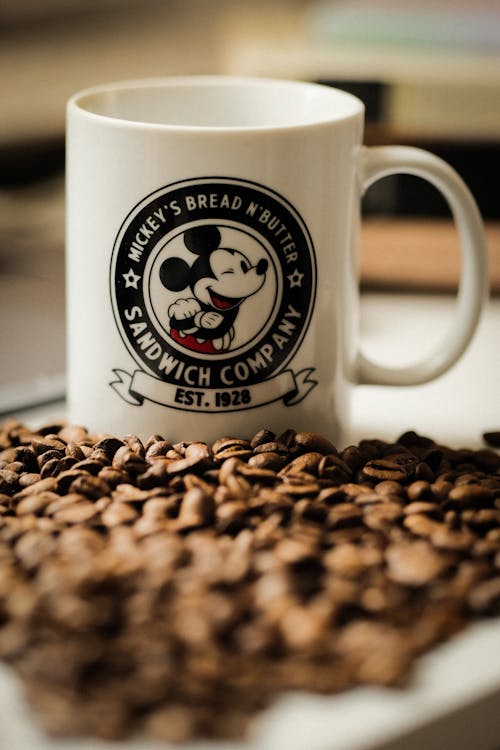 Free Mickey Mouse Mug on Coffee Beans Stock Photo