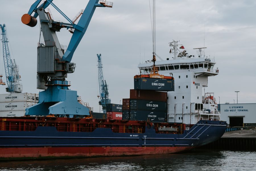 Cargo ship at port representing global shipping logistics
