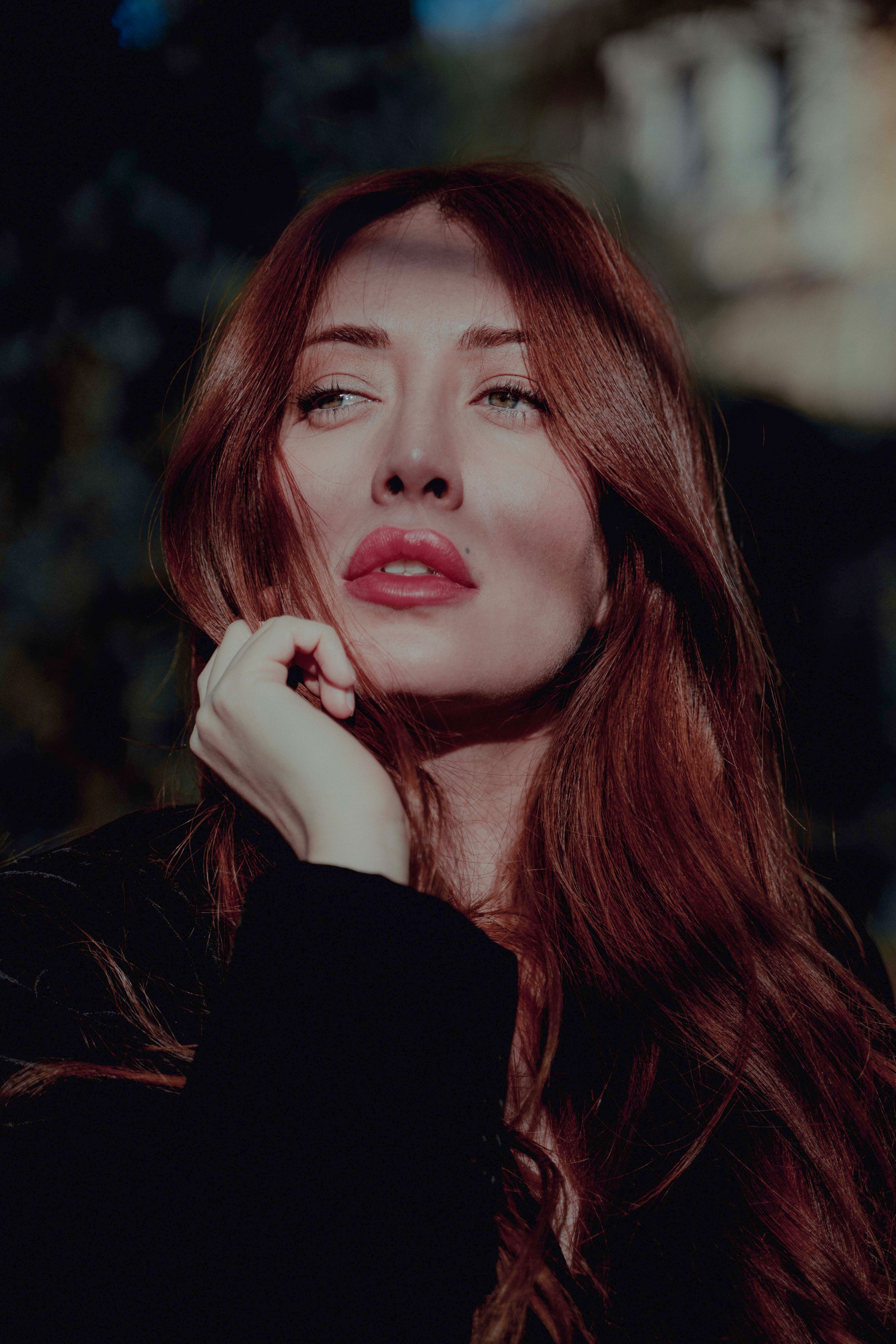 Portrait of a Red-haired Woman in the Park · Free Stock Photo