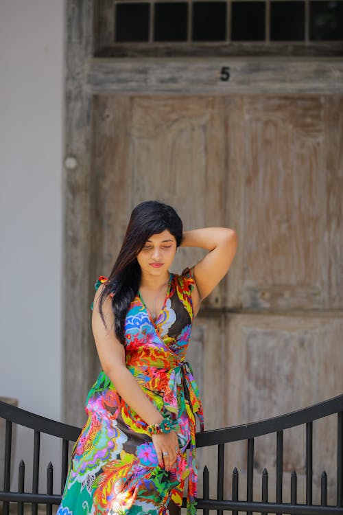 Woman Wearing Colorful Dress on a Street 
