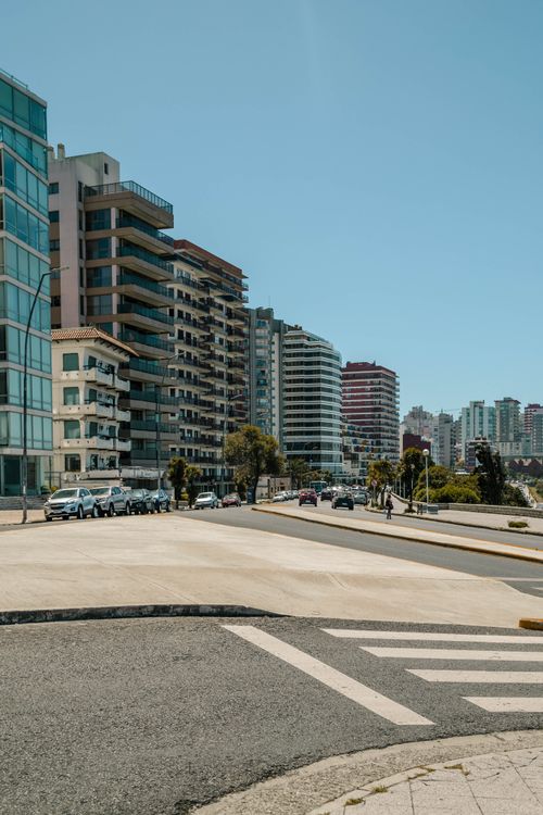 Free Vibrant cityscape showcasing residential buildings in Mar del Plata, Argentina under a clear sky. Stock Photo
