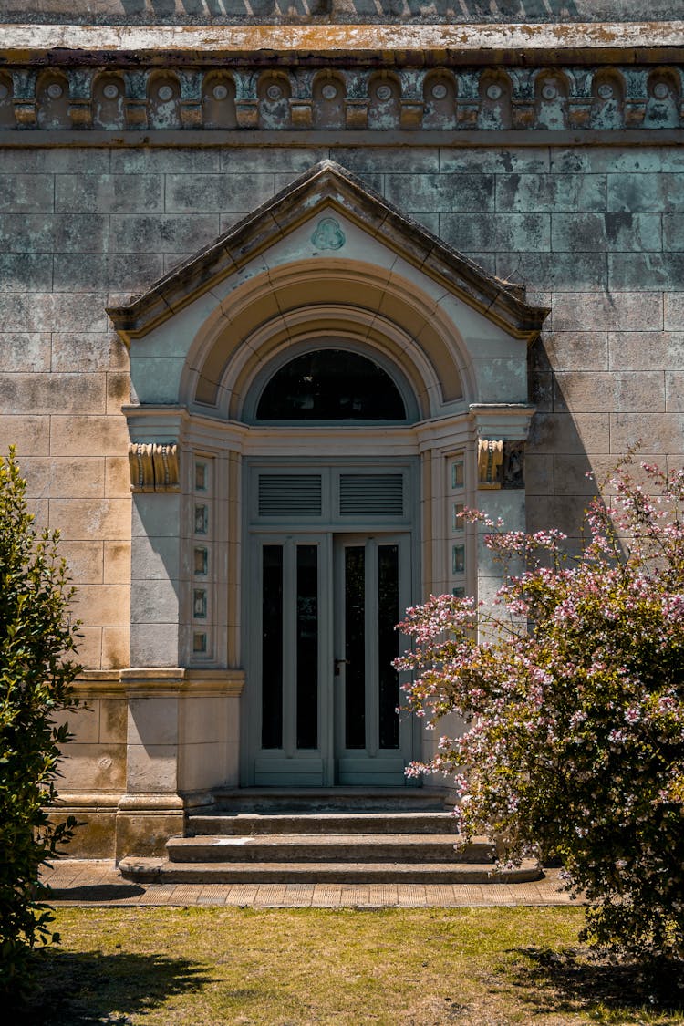 Bushes And Lawn Near Building Entrance