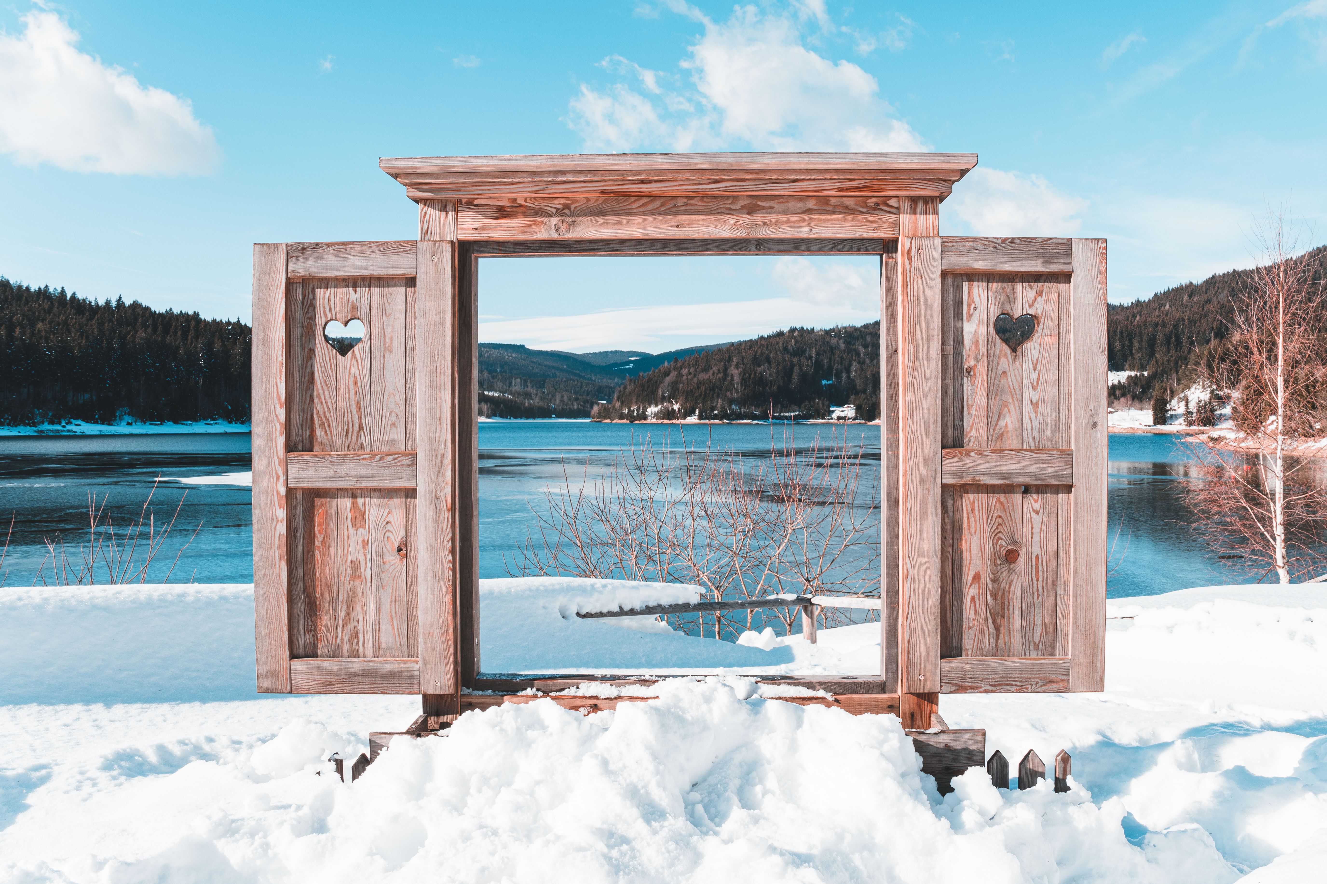 Rustic wooden window frame with snow view in Sankt Oswald ob Eibiswald, Austria.