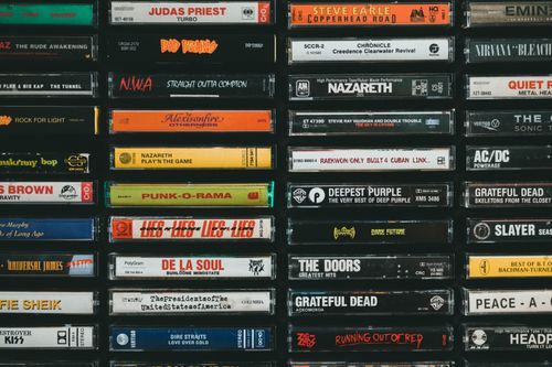Free A nostalgic display of vintage cassette tapes featuring iconic bands and albums from the past. Stock Photo