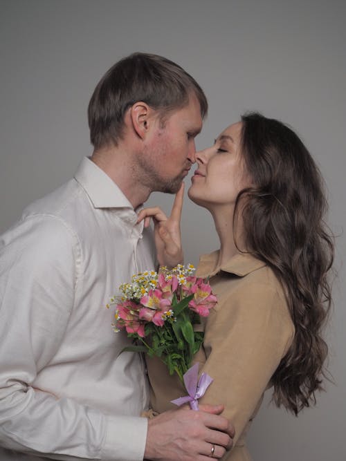 Woman and Man Hugging with Flowers