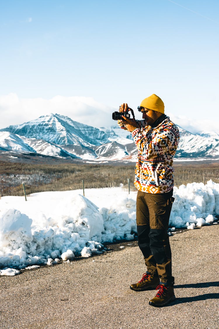 Man Photographing In The Mountains