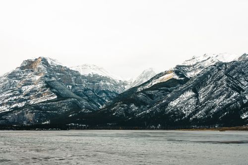 Free Stunning view of snow-capped mountains and lake in Jasper, Alberta during winter. Stock Photo