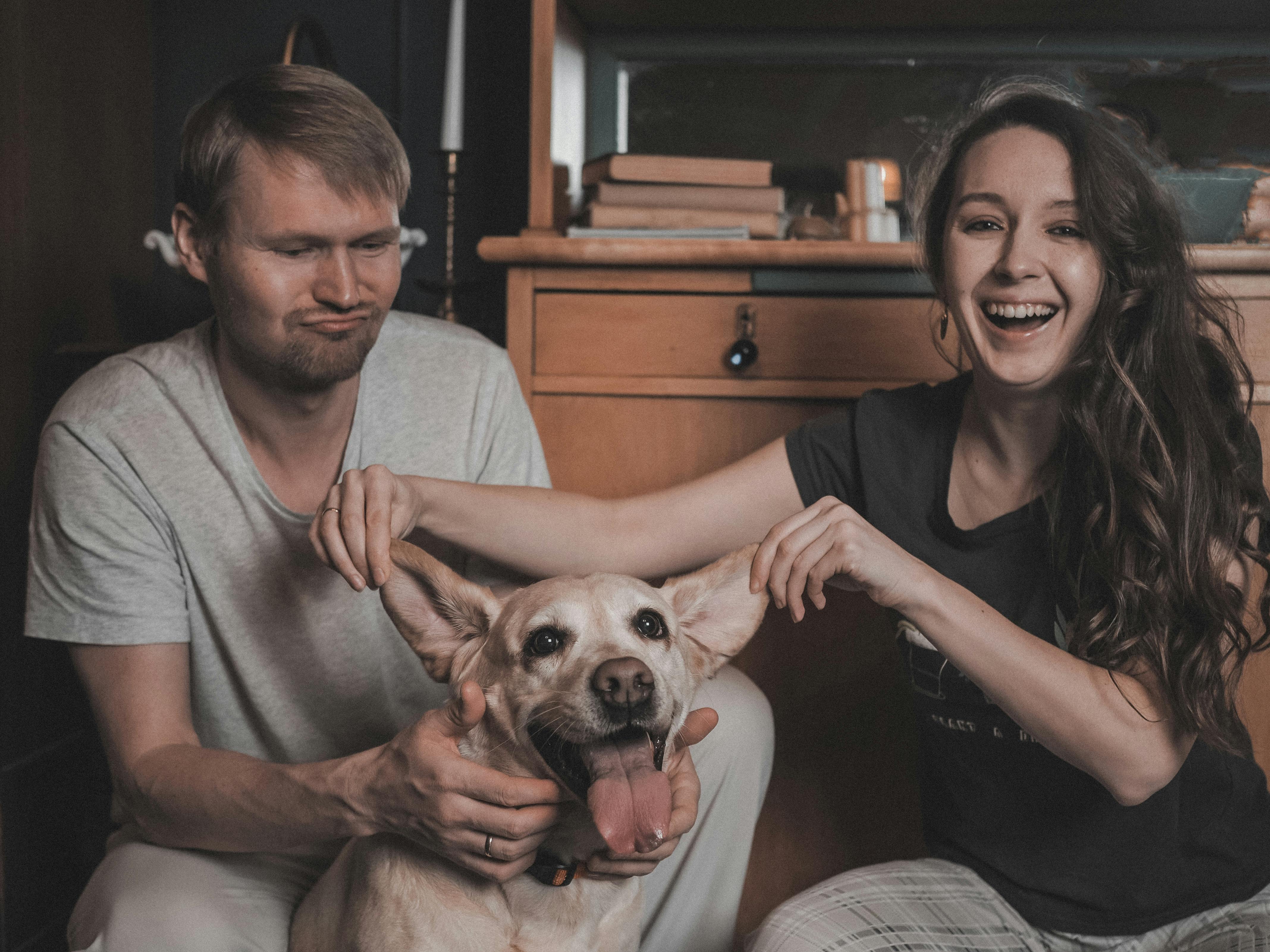 Couple Posing with Dog · Free Stock Photo